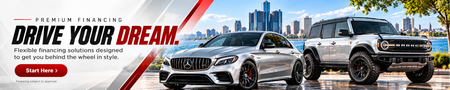 Dream Motors financing banner featuring a white Mercedes-AMG sedan and a black Ford Bronco parked along a Detroit waterfront skyline, with bold text reading “Easy Financing,” “Drive Your Next Ride With Confidence,” and a red “Start Here” button.